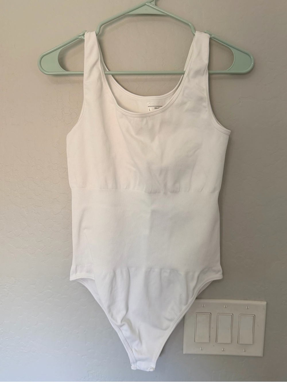 Women’s White Sleeveless One-Piece Bodysuit